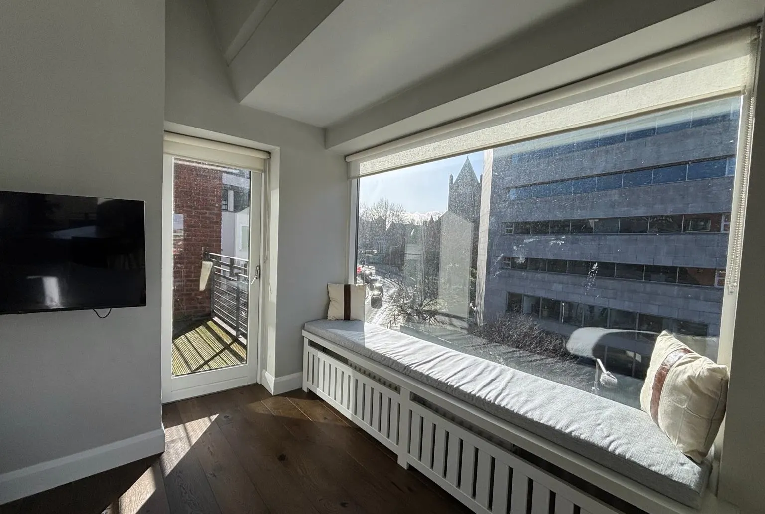 Living area with window seat, cleaned and reset between guests